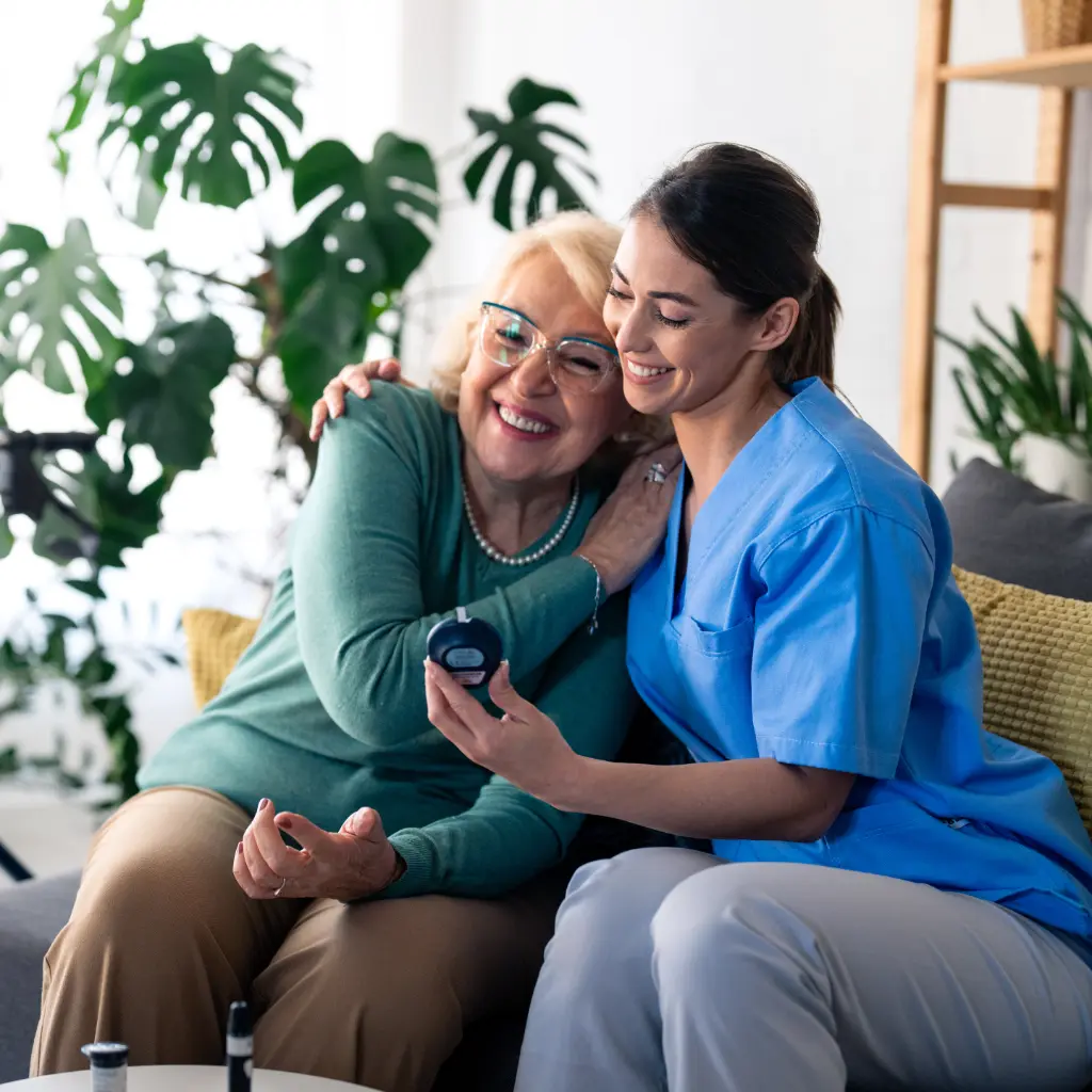 A couple receives 24-hour support from Thrive On Care while sitting comfortably at home.