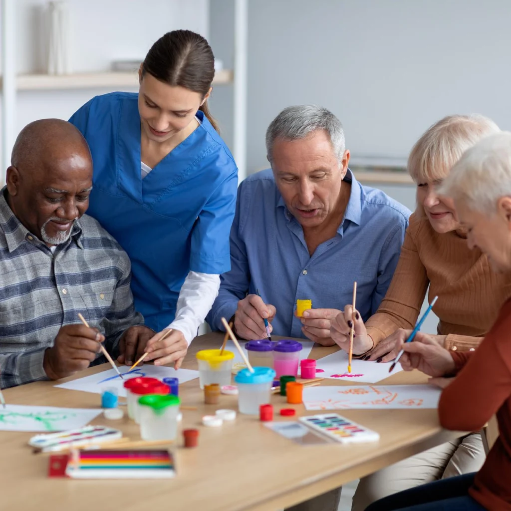 Thrive On Care encourages creative expression through group painting sessions.