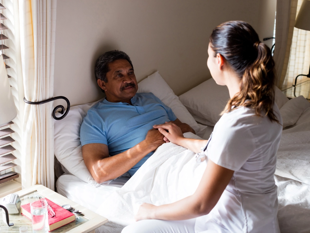 Thrive On Care provides overnight care for women laying in bed with a pillow.