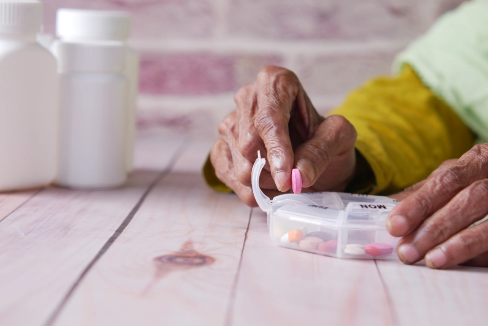 A Thrive On Care staff member organizes medicine for a patient in San Antonio.