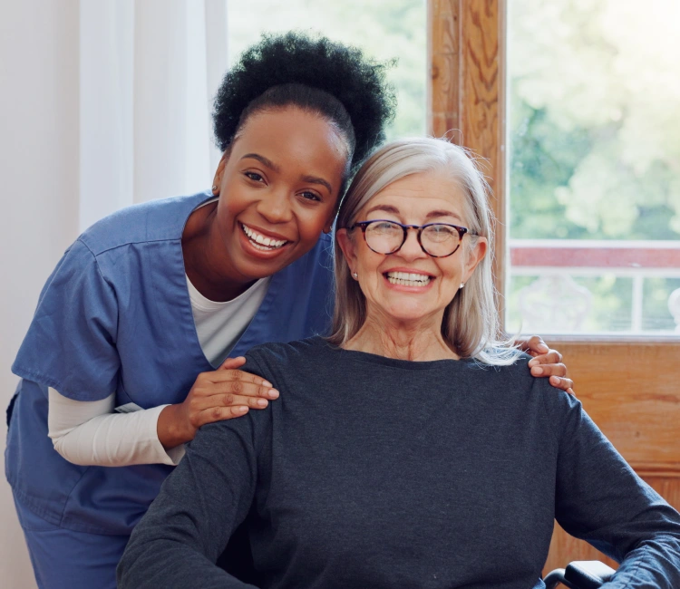 A smiling couple holds documentation after coordinating care with Thrive On Care in Texas.