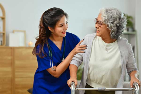 Thrive On Care offers companion care as two women stand together in a private room.