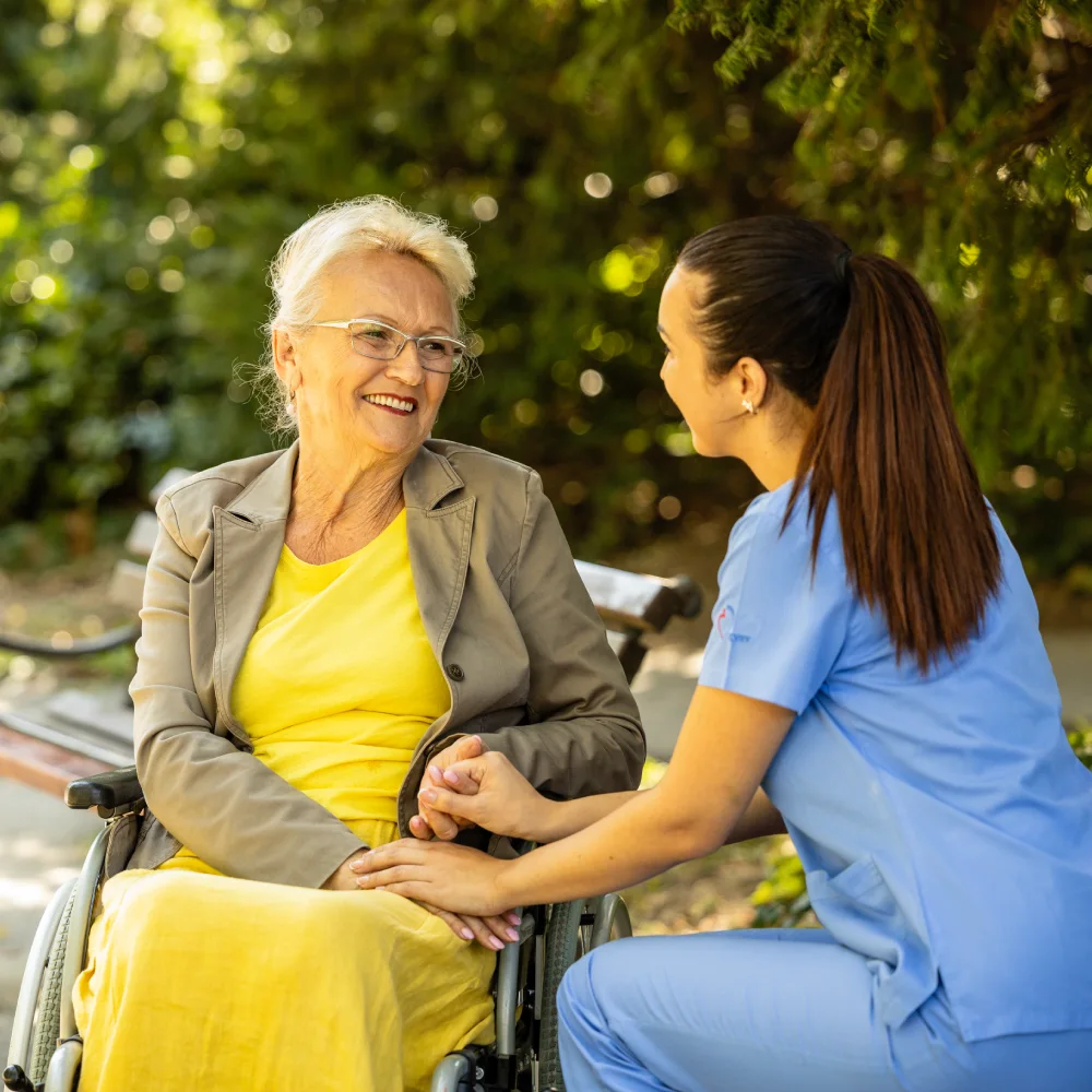 A couple receives emotional support from Thrive On Care while sitting on a bench.
