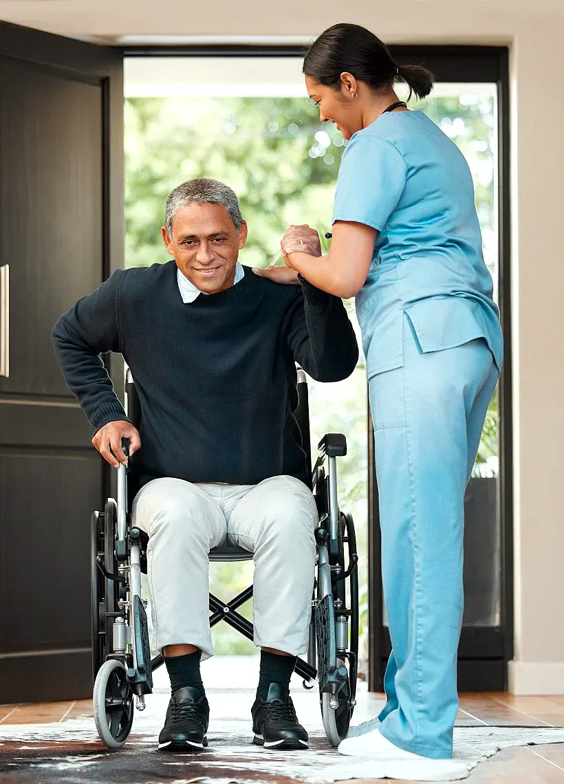 Thrive On Care nurse helps a man in a wheelchair with mobility assistance in San Antonio, TX.